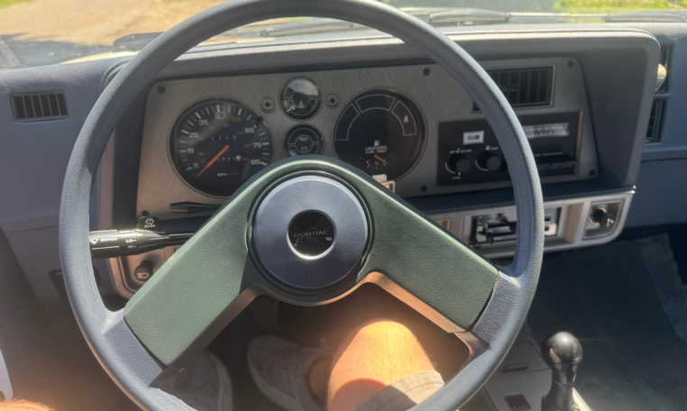 Steering wheel with instrument cluster in the back.